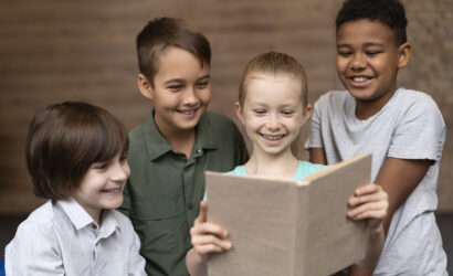 medium shot happy kids reading together